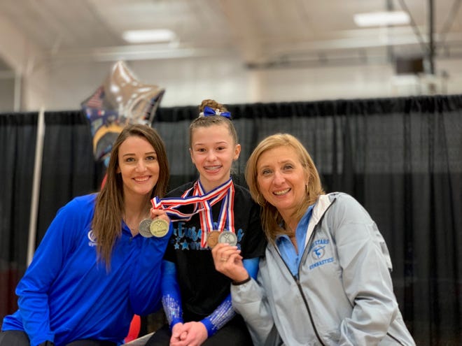 Northville middle school gymnast Sophia Reddy is the level nine state champion on bars.
