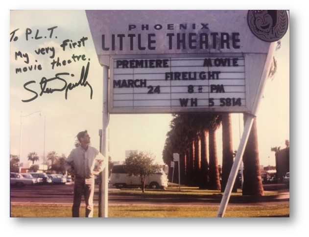 Steven Spielberg standing in front of Phoenix Theatre for the debut of his first movie, "Firelight," when he was in high school.