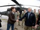 Iowa Gov. Kim Reynolds shakes Vice President Mike Pence's hand in Omaha, Neb. on, March 19, 2019, after they toured by helicopter areas flooded by the Missouri River. 