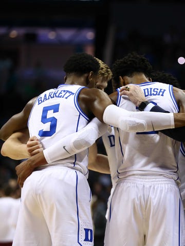 The Duke Blue Devils huddle up in the second half against the Florida State Seminoles in the ACC conference tournament at Spectrum Center.