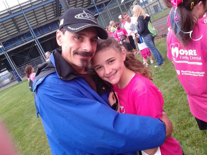 Rob Agnello of Grand Island, N.Y. is shown with his daughter, 14, who died by suicide in December 2015.