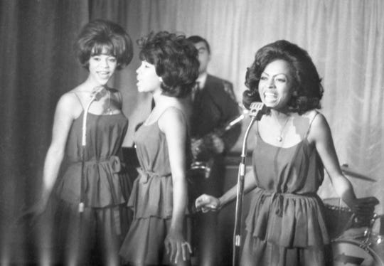 Diana Ross, right, performs in London on Oct. 8, 1964. 