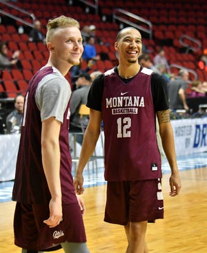 Montana guard Timmy Falls smiles with teammate Kendal Manuel at Wednesday's practice.