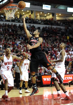 In this December 2010 photo, Cliff Dixon, No. 5, is seen during a Louisville-Western Kentucky game in Bowling Green. The former WKU player was killed in March 2019 in Georgia.