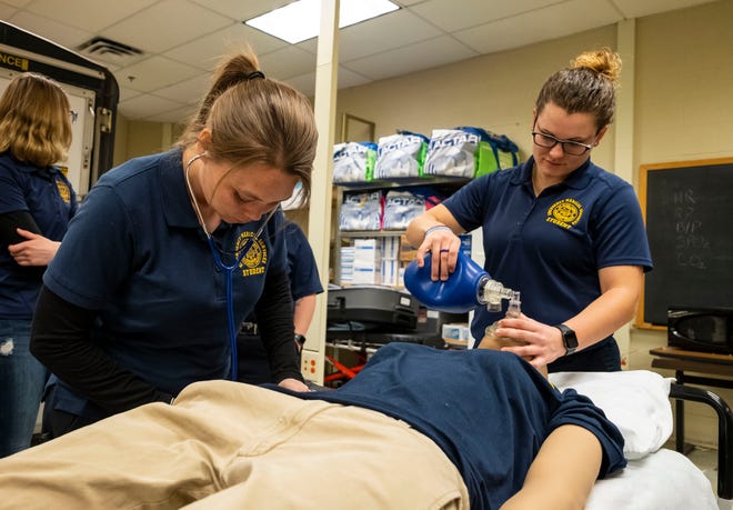 Amanda Aldridge, left, practices checking blood pressure on a training mannequin while Tori Fite practices ventilating during a drill Thursday, March 21, 2019 at SC4.