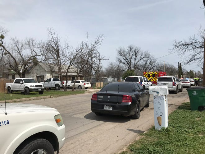 Police and ambulances arrive at a residence on East 22nd Street, Thursday, March 21, 2019.