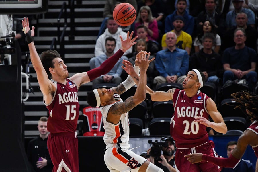 Auburn Tigers guard Bryce Brown (2) reacts as the ball goes loose with New Mexico State Aggies forward Ivan Aurrecoechea (15) and guard Trevelin Queen (20).