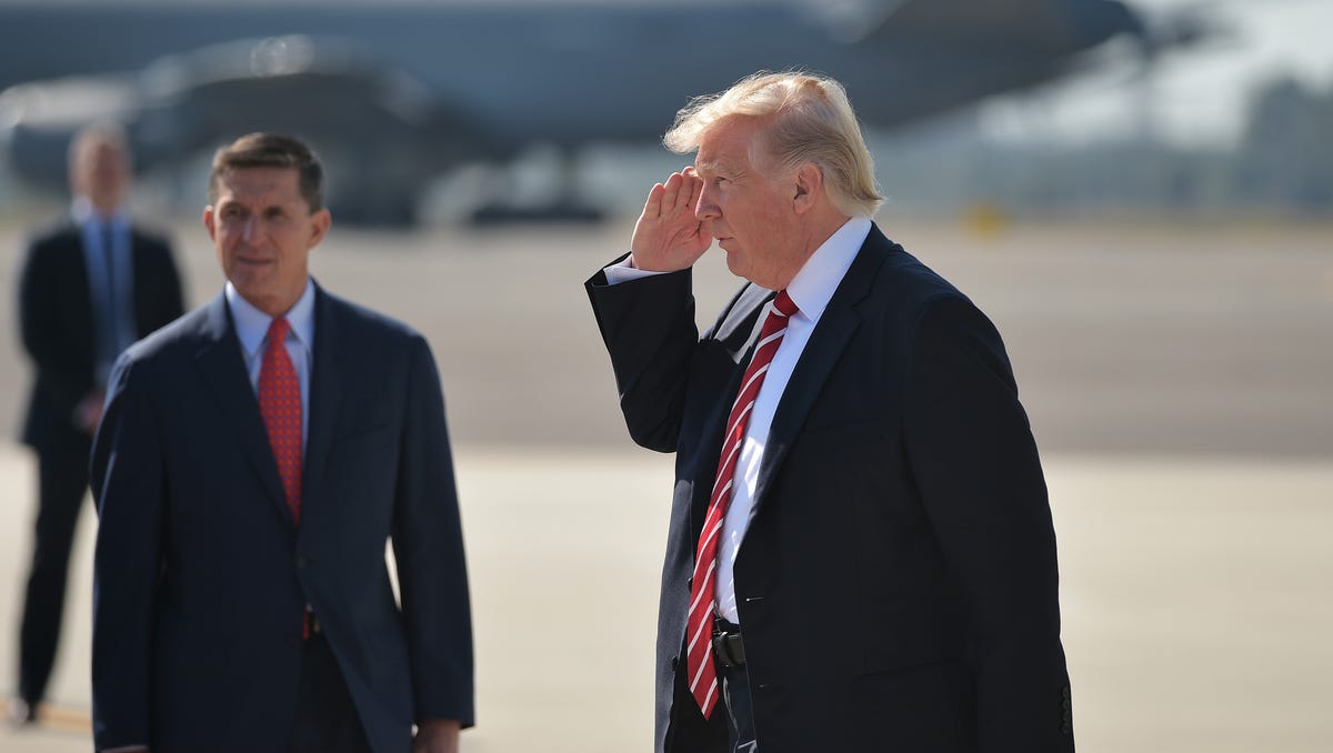 National Security Advisor Michael Flynn and President Donald Trump arrive at MacDill Air Force Base in Tampa, Florida to visit the U.S. Central Command and Specials Operations Command on Feb. 6, 2017.