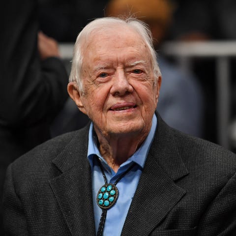 Former president Jimmy Carter shown at the game...