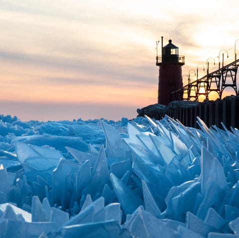 Shards of ice pile up on Lake Michigan along the...