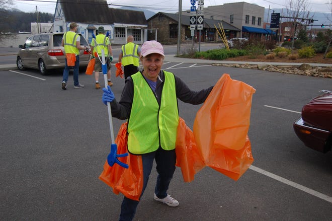 Black Mountain Beautification Committee member Tracy Munn participates in a litter sweep last fall.