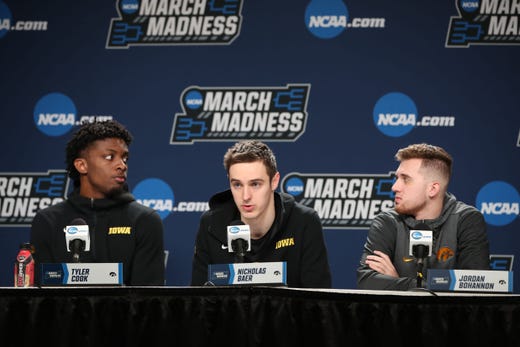 Iowa Hawkeyes forward Tyler Cook (25) forward Nicholas Baer (51) guard Jordan Bohannon (3) speak with the media during practice before the first round of the 2019 NCAA Tournament at Nationwide Arena on March 21, 2019, in Columbus, Ohio.