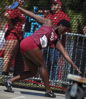 Florida State junior Shanice Love throws discus during Friday's college portion of the FSU Relays at Mike Long Track.