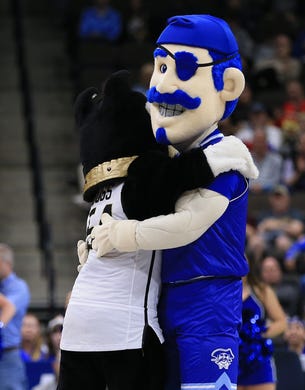 First round: The mascots for Wofford and Seton Hall hug it out on the court.