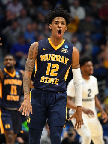 Murray State Racers guard Ja Morant (12) reacts to a score against the Marquette Golden Eagles during the first half in the first round of the 2019 NCAA Tournament at XL Center.