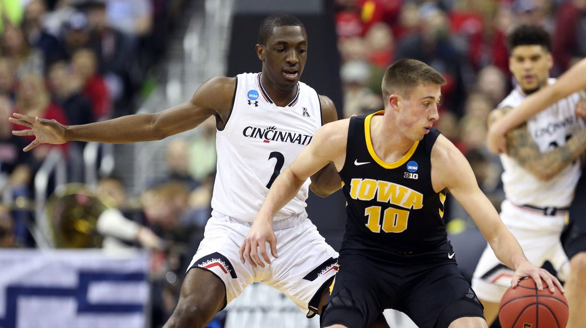 Iowa guard Joe Wieskamp is defended by Cincinnati guard Keith Williams during the first round of the 2019 NCAA tournament.