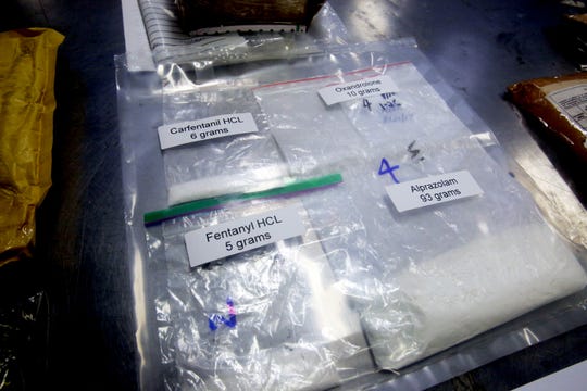Packages containing fentanyl and carfentanil are stored in the detention room of the federal inspection site of postal facilities at JFK International Airport after being discovered by customs and border protection officers from the United States on this archive photo.