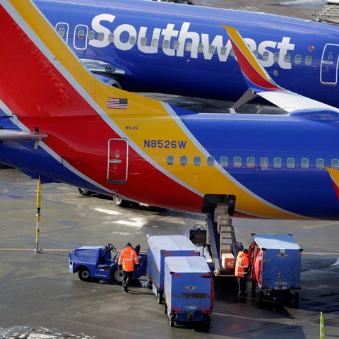 Southwest Airlines planes are loaded at...