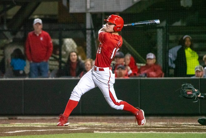 UL's Hunter Kasuls watches his hit as the Ragin' Cajuns take on the Appalachian State Mountaineers at M.L. "Tigue" Moore Field on Friday, March 22, 2019.