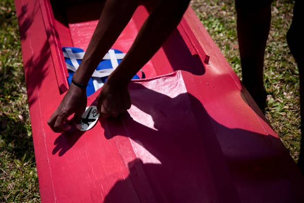 Greesh Paruchuri puts a sticker on his kayak at Riverside Park in Bonita Springs on Sunday, March 24, 2019.