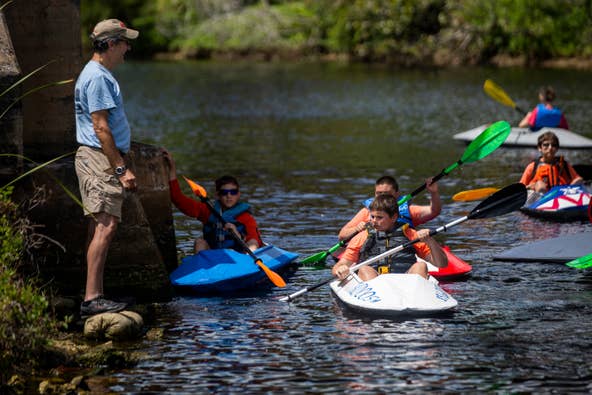 Scoutmaster Mark Cecil organizes his troop for a relay race at Riverside Park in Bonita Springs on Sunday, March 24, 2019.