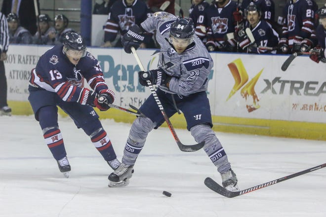 Pensacola's Eddie Matsushima (24) works to maintain control of the puck against Macon during the last home game of the regular season at the Pensacola Bay Center on Saturday, March 23, 2019. With over 4,300 people in attendance for Pensacola's 3-1 victory, the Ice Flyers mark six straight years of over 100,000 people at their home games each season. The team has won their last five games in a row and will finish out their last five games on the road before entering the playoffs in a couple of weeks.