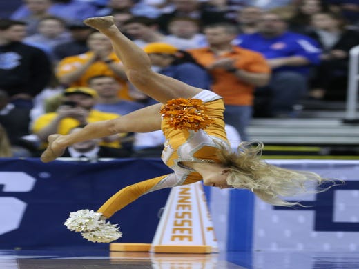 Round of 32: Volunteers cheerleader flips during a routine.