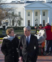 Special Counsel Robert Mueller, and his wife Ann, walk past the White House, to St. John's Episcopal Church for morning services on Sunday, March 24, 2019 in Washington. Mueller closed his long and contentious Russia investigation with no new charges, ending the probe that has cast a dark shadow over Donald Trump's presidency.