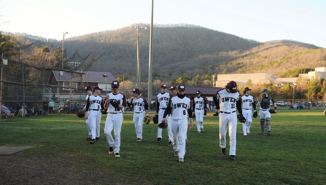 The Owen Warhorses head to the dugout after warming up before a loss at home to the Madison Patriots on March 19.