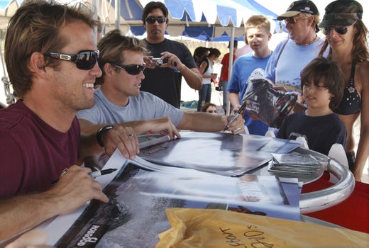 2006: CJ & Damien Hobgood, sign autographes for the crowd after surfing their heats at wednesdays Association of Surfing Professionals , Globe Sebastian Inlet Pro pres by Ron Jon $75,000 4 star "WQS" event, held at the Sebastian Inlet.