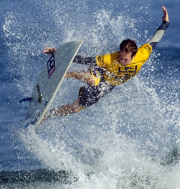 2006: CJ Hobgood, goes airborne during thursdays finals at the Association of Surfing Professionals , Globe Sebastian Inlet Pro pres by Ron Jon $75,000 4 star "WQS" event, held at the Sebastian Inlet. CJ finish second to his Brother Damienin the finals.