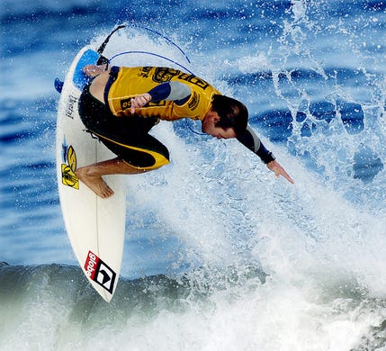 2006:,CJ Hobgood, goes airborne during thursdays finals at the Association of Surfing Professionals , Globe Sebastian Inlet Pro pres by Ron Jon $75,000 4 star "WQS" event, held at the Sebastian Inlet. CJ finish second to his Brother Damienin the finals.