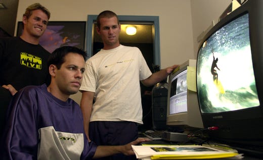 2000: Justin Purser, seated, edits his film, "All Tha Way Live," which featured Satellite Beach?s Damien and C.J. Hobgood. Now, Purser is doing a documentary.