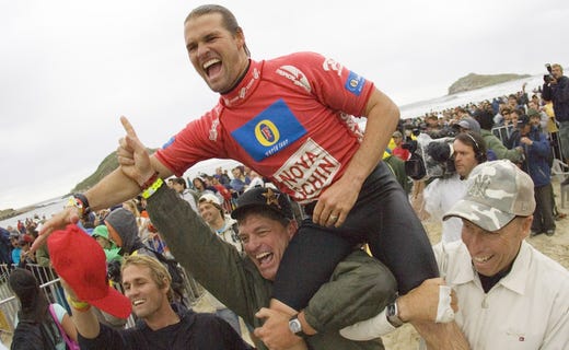 2005: Damien Hobgood (Satellite Beach, Fl, USA) (pictured) is carried up the beach by friends after he clinched the Nova Schin Festival Presented by Billabong title at Imbituba, Brazil today. Hobgood narrowly defeated crowd favorite Victor Ribas (Bra) (pictured left) to claim his first victory of the 2005 ASP WCT season and US$30 000 in prize money. The Floridian moved into fifth position on the ASP WCT ratings.