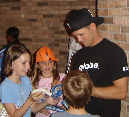 2007: Well-known surfer CJ Hobgood took time out to sign autographs after giving a talk to students attending Vacation Bible School at Satellite Beach United Methodist Church.