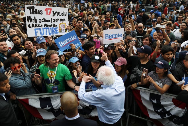 LOS ANGELES, CALIFORNIA - MARCH 23:  2020 Democratic presidential candidate U.S. Sen. Bernie Sanders (I-VT),  BOTTOM C, greets supporters at a campaign rally in Grand Park on March 23, 2019 in Los Angeles, California. Sanders, who is so far the top Democratic candidate in the race, is making the rounds in California which is considered a crucial 'first five' primary state by the Sanders campaign. California will hold on early primary on March 3, 2020.