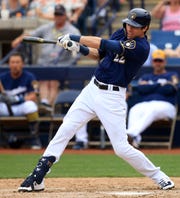 Milwauke Brewers' Christain Yelich continues his swing in their spring training match against the Los Angeles Dodgers on Thursday, March 21, 2019 in Phoenix, Arizona. (Photo / Roy Dabner) ORG XMIT: RD255