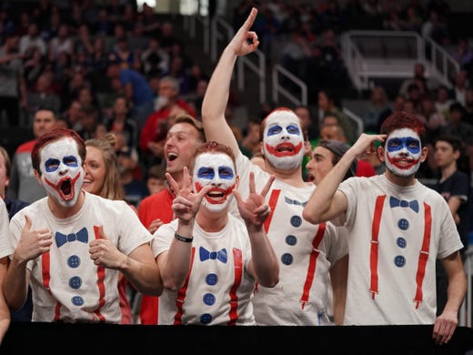 Round of 32: Liberty Flames fans cheer during the first half.