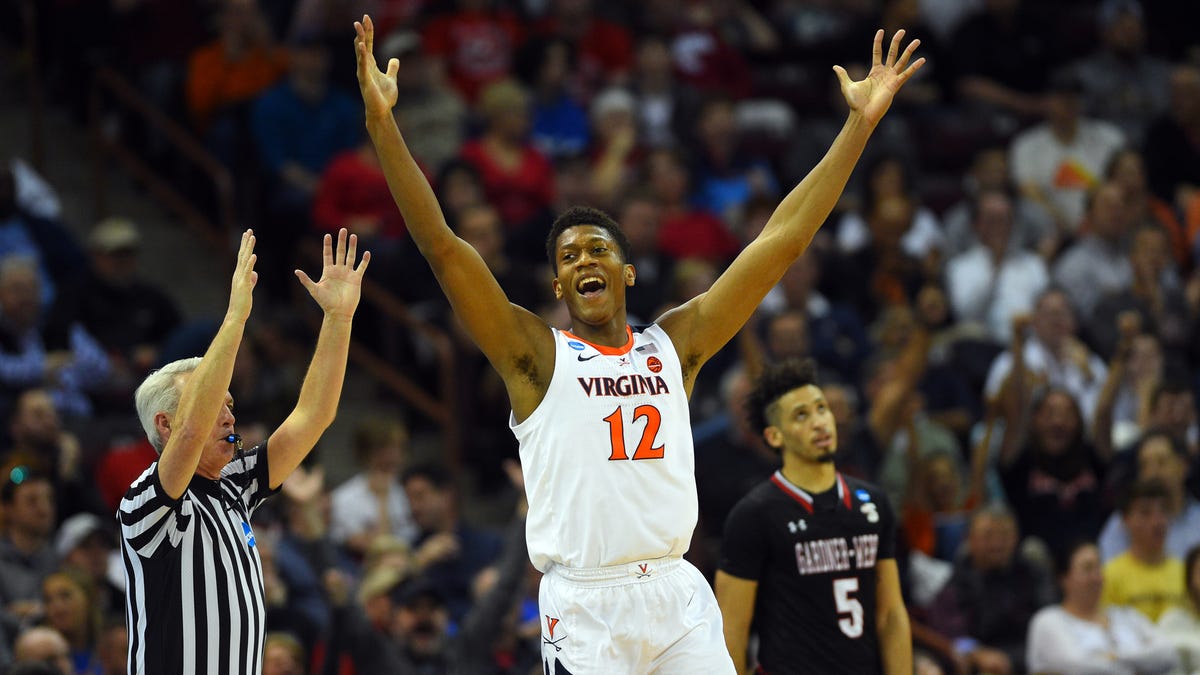 Virginia's De'Andre Hunter celebrates after making a basket during the second half of the Cavaliers' first-round game.