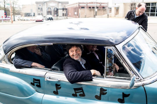 Famed documentary filmmaker Ken Burns rolls up to Sun Studios in a Cadillac during a visit as part of a bus tour to promote the new 8-part series "Country Music."