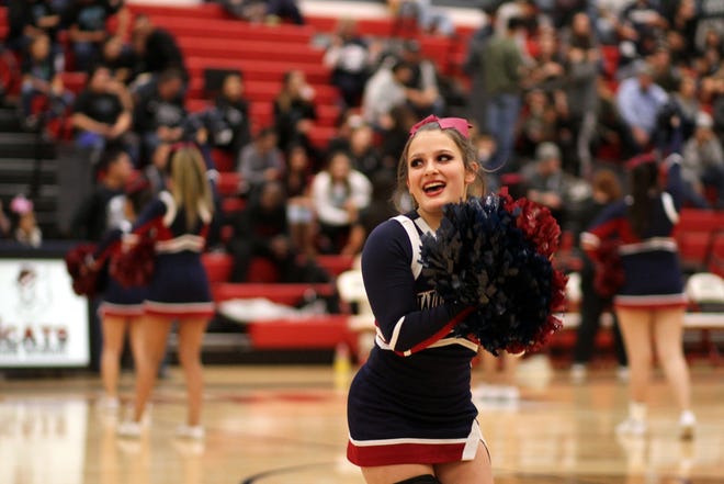 Wildcat junior Ciera Wood fires up the crowd during a Wildcat basketball game.