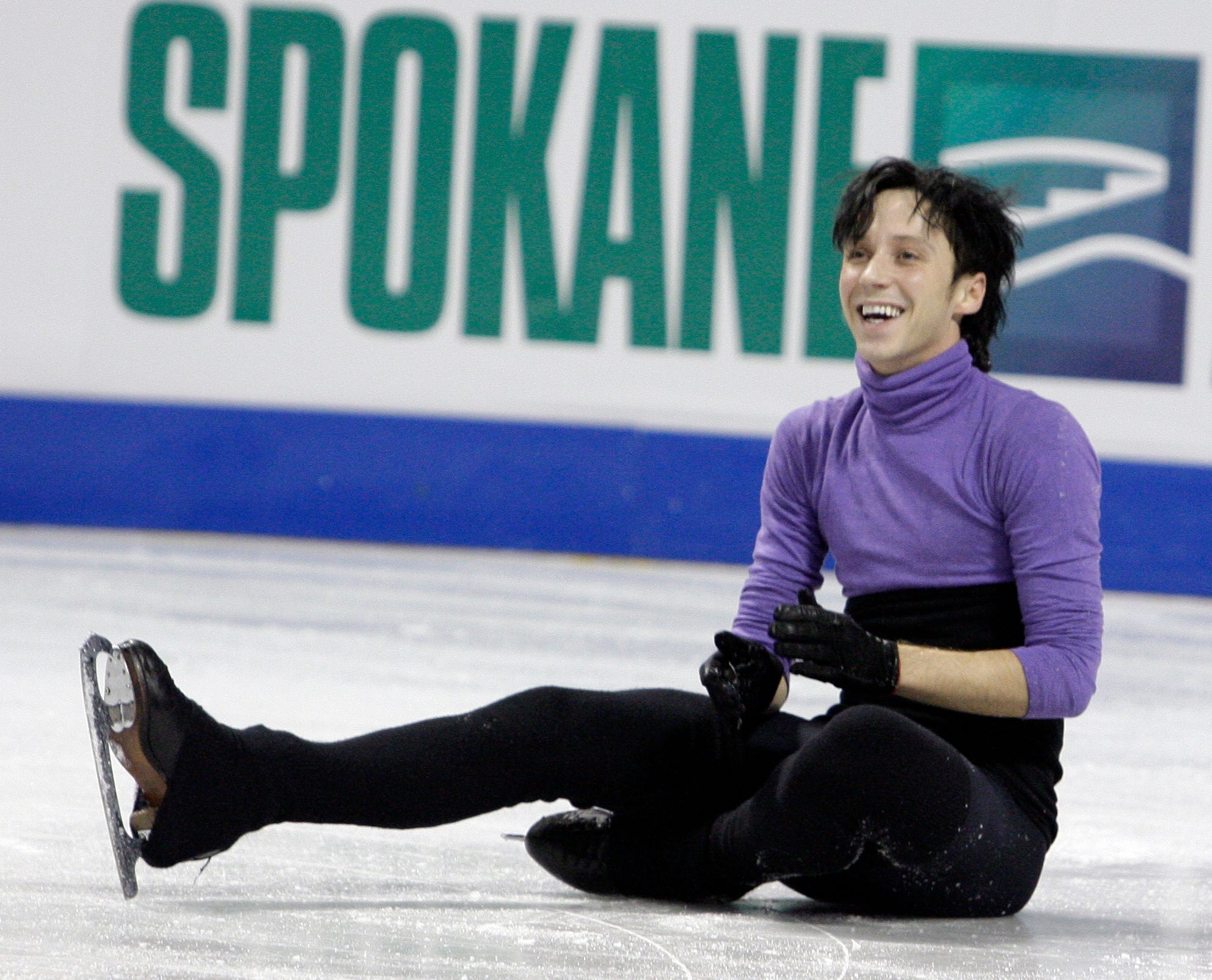 Johnny Weir smiles after he stumbled during a practice session in preparation for the U.S. Figure Skating Championships, Thursday, Jan. 14, 2010, in Spokane, Wash.