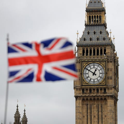 A British flag flies near the "Big Ben" clock towe