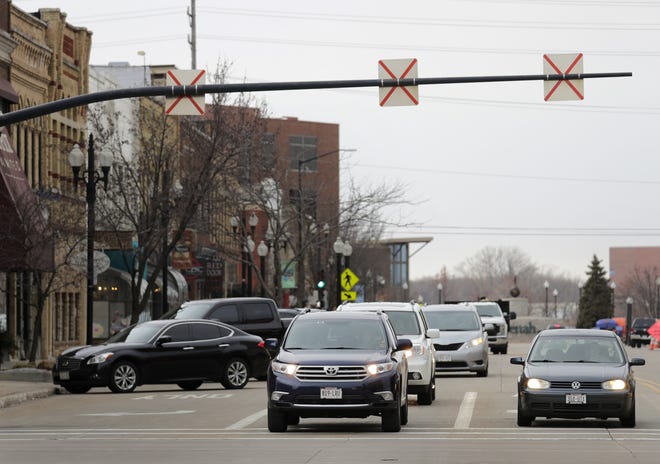 Traffic moves east on Wisconsin Avenue through downtown Neenah.
