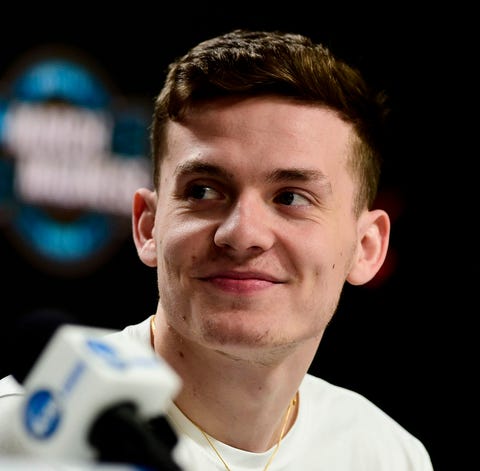 Cavaliers guard Kyle Guy (5) speaks at a press...