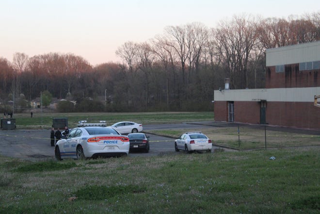 Officers outside the scene of a shooting near Chickasaw Middle School on Tuesday evening.