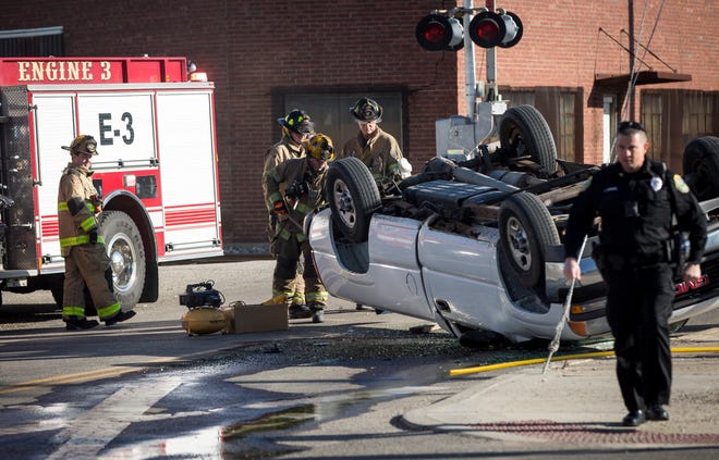 Firefighters and police respond to an accident when a pickup truck struck a guy wire near and flipped on March 27 near West Willard Street and Hoyt Avenue. The driver, found walking  near the crash scene by officers , was taken to IU Health Ball Memorial Hospital for an examination. 