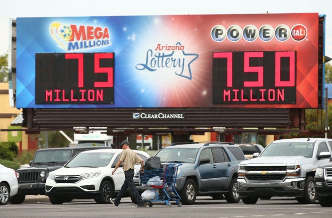 A billboard at 44th Street and McDowell Road displays the jackpots for Mega Millions and Powerball on Mar. 27, 2019.
