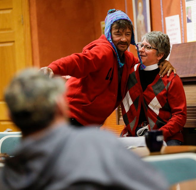Frank Legner hugs the Rev. Jane Johnson on March 26, 2019, at Franciscans Downtown in Stevens Point. Johnson heads Extending the Table, a local outreach ministry for the homeless, LGBT and youth communities.