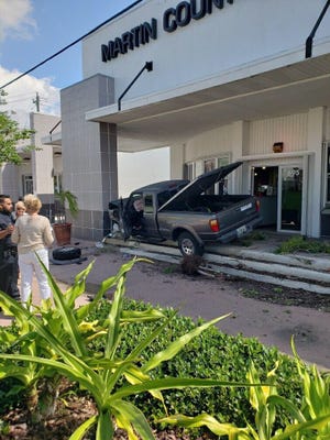 Truck driver crashed into building in Stuart Wednesday afternoon.